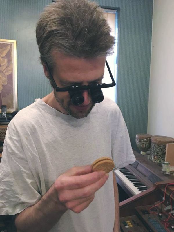 Frank inspecting a biscuit